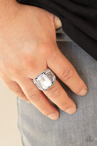 Paparazzi " Conquered " Silver Metal & White Emerald Cut Rhinestone Men's Elastic Back Ring