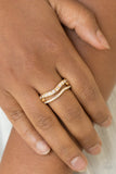 Paparazzi " Elite Squad " Gold & White/Clear Rhinestone Wavy Elastic Back Ring