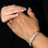 "A Grandmothers Love" Silver Metal with "Grandma" Surrounded by Hearts Cuff Bracelet