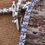 Platinum over Sterling Silver 8.9cts Tanzanite Oval Line Bracelet (8.00 in)