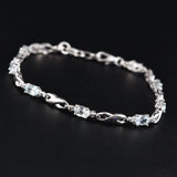 Platinum over Sterling Silver Sky Blue Topaz Bracelet Eternity Symbols