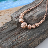 14K Rose Gold over Sterling Silver Graduated Textured Bead Adjustable Bracelet