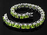 Rhodium/Sterling Silver 27cts. Vibrant Green PERIDOT Tennis Bracelet (Size 7.25")